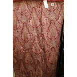 A PAIR OF VERMILLION GROUND PAISLEY STYLE INTER LINED CURTAINS,EACH 2.6 X 2.5 METRES