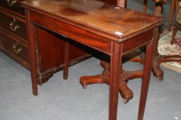 A LATE GEORGIAN MAHOGANY FOLD OVER CARD TABLE