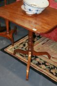A LATE GEORGIAN MAHOGANY TRIPOD TABLE TOGETHER WITH A VICTORIAN WALNUT SMALL CENTRE TABLE