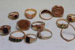 A 9CT.GOLD THREE STONE OPAL AND RUBY SET DRESS RING AND TWELVE ASSORTED DRESS RINGS. (13)   £250-