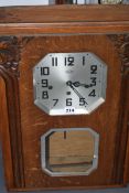 A GERMAN ART DECO WALL CLOCK WITH CHIMING MOVEMENT