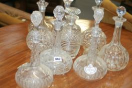 A QUANTITY OF VARIOUS CUT GLASS DECANTERS