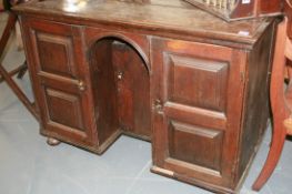 A RARE AND UNUSUAL 18TH.C. PANELLED OAK KNEEHOLE DESK
