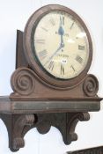 A LATE VICTORIAN OAK CASED BRACKETED WALL CLOCK WITH FUSEE MOVEMENT AND PAINTED DIAL SIGNED