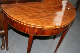 A REGENCY MAHOGANY AND BOX STRUNG FOLD OVER TEA TABLE