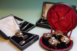 A CASED SET OF FOUR SILVER SALTS, LONDON 1900, A CASED CHRISTENING EGG CUP AND SPOON, B'HAM 1928,