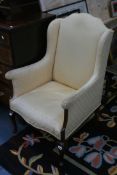 AN EDWARDIAN INLAID WING ARMCHAIR ON CABRIOLE LEGS TOGETHER WITH A SIMILAR EXAMPLE ON SQUARE TAPER