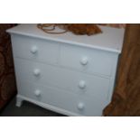 A PAINTED CHEST OF TWO SHORT AND TWO LONG DRAWERS