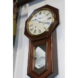 A VICTORIAN ROSEWOOD CASED DROP DIAL STRIKING WALL CLOCK TOGETHER WITH A 1920'S OAK CASED CHIMING