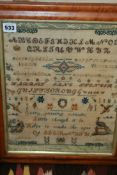 A CIRCA 1854 SAMPLER IN MAPLE FRAME