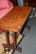 A VICTORIAN MAHOGANY AND INLAID GAMES TABLE