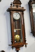 A VICTORIAN WALNUT CASED VIENNA REGULATOR STRIKING WALL CLOCK WITH TWIN WEIGHT DRIVEN MOVEMENT