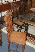 A GROUP OF NINE CARVED OAK HALL CHAIRS
