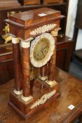 A MID 19TH.C.EMPIRE STYLE PORTICO CLOCK WITH FRENCH BELL STRIKE MOVEMENT AND ORMALU MOUNTS