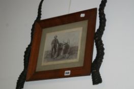 A TAXIDERMY PAIR OF HORNS MOUNTED TO THE FRAME OF A PERIOD PHOTOGRAPH DEPICTING THE HINTER INSCRIBED