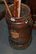 A LEATHER CHARGE CARRIER AND VARIOUS WALKING STICKS