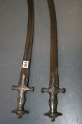 A PAIR OF INDIAN TULWAR WITH DAMASCENE HILTS