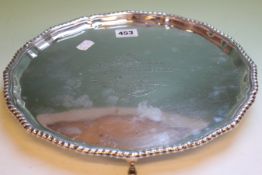 A SILVER SALVER ON FOUR HOOF FEET WITH GADROON BORDER. CHESTER 1908. 29ozs