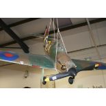 A HAND BUILT FLYING MODEL OF A WWII HURRICANE