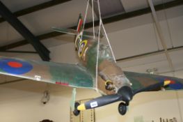 A HAND BUILT FLYING MODEL OF A WWII HURRICANE