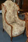 AN EDWARDIAN MAHOGANY AND INLAID WING BACK ARMCHAIR
