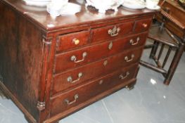 A LATE GEORGIAN OAK CHEST OF THREE SHORT AND THREE LONG DRAWERS
