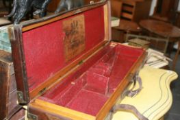 A 19TH.C.OAK AND LEATHER GUN CASE WITH LABEL FOR JAMES WOODWARD