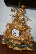 A VICTORIAN GILT METAL MANTLE CLOCK WITH ENAMEL DIAL AND FRENCH MOVEMENT
