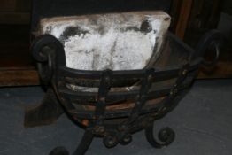 A CAST IRON FIRE BASKET