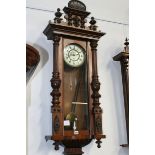 A VICTORIAN VIENNA REGULATOR WALL CLOCK WITH ELABORATE CARVED CASE