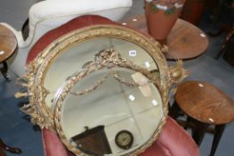 TWO OVAL GILT FRAMED WALL MIRRORS