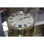 A LARGE EARLY 20TH.C.BRASS BULKHEAD CLOCK WITH SINGLE FUSEE MOVEMENT