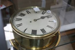 A LARGE EARLY 20TH.C.BRASS BULKHEAD CLOCK WITH SINGLE FUSEE MOVEMENT