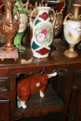 A POTTERY FIGURE OF A BULL AND VARIOUS VASES