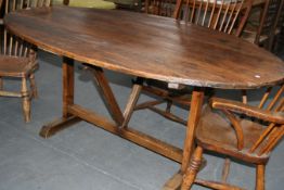 A MID 19TH.C.PINE AND ELM TILT TOP VINYARD TABLE