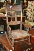AN UNUSUAL ARTS AND CRAFTS CHILD'S ROCKING CHAIR