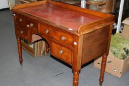 AN EARLY VICTORIAN MAHOGANY GALLERY BACK WRITING DESK