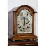 AN EDWARDIAN MAHOGANY CASED BRACKET CLOCK WITH THREE TRAIN CHIMING MOVEMENT BY GUSTAV BEKKER AND A