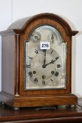 AN EDWARDIAN MAHOGANY CASED BRACKET CLOCK WITH THREE TRAIN CHIMING MOVEMENT BY GUSTAV BEKKER AND A