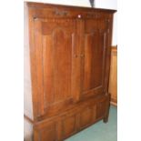 AN 18TH.C.OAK LIVERY OR HALL CABINET DATED 1738