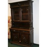 A FRENCH 19TH.C.OAK BOOKCASE CABINET WITH CARVED DECORATION