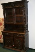 A FRENCH 19TH.C.OAK BOOKCASE CABINET WITH CARVED DECORATION