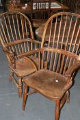 FOUR EARLY 19TH.C.BEECH AND ELM SPINDLE BACK WINDSOR ARMCHAIRS