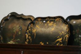 THREE 19TH.C.HAND PAINTED PAPIER MACHE TRAYS TOGETHER WITH A SIMILAR SMALL BASKET