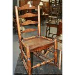 A RUSTIC CHILD'S ROCKING CHAIR AND A COUNTRY MADE STOOL