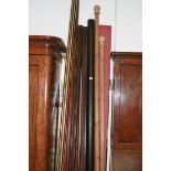 A LARGE COLLECTION OF CURTAIN POLES AND RAILS