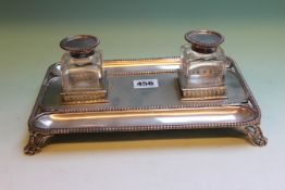 A SILVER DESK INKSTAND FITTED WITH TWO GLASS RECIEVERS WITH BEADED BORDERS. LONDON 1891, MAKER