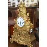 A VICTORIAN ORMALU CASED MANTLE CLOCK WITH FRENCH BELL STRIKE MOVEMENT AND ENAMELLED DIAL SIGNED