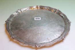 A SILVER SALVER WITH PIERCED BORDER ON BUN FEET, MARKS FOR SHEFFIELD, DATE LETTER RUBBED,