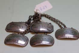 A SET OF THREE SILVER WINE LABELS, LONDON 1820, MAKER'S INITIALS I.R., SHERRY ,PORT AND MADEIRA